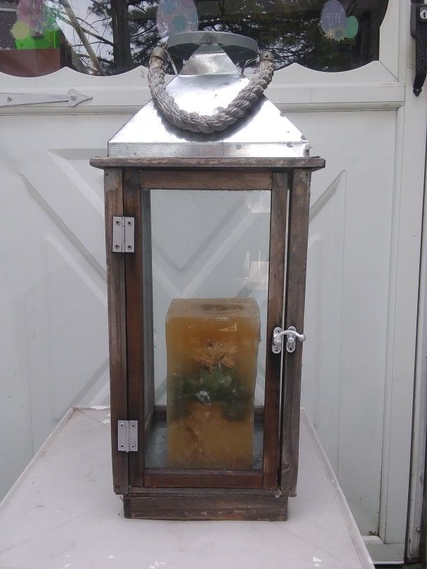 Wood And Metal Lantern With A Candle