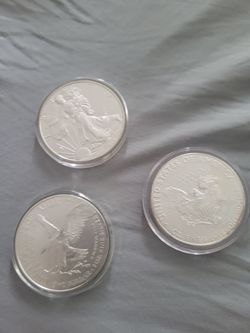 3 SILVER EAGLE COINS PERFECT SHAPE. PSA 9
