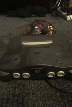 Nintendo 64 with super smash and a controller