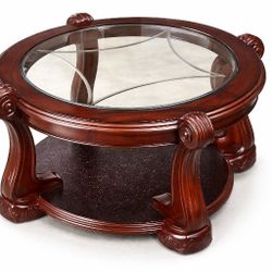 Elegant round glass coffee table with solid wood carved base.
High-end look, very sturdy and heavy. Perfect centerpiece for living room.
Clean and wel
