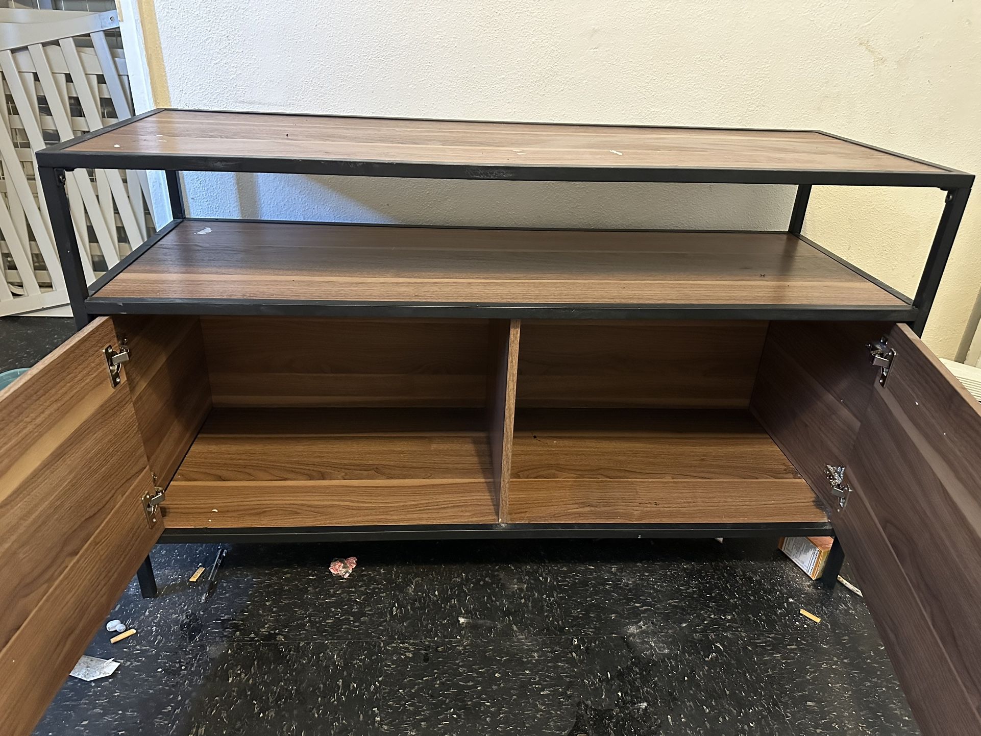 Real wood entertainment center with two doors on the front