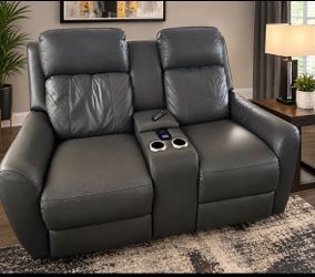 charcoal gray leather dual reclining console loveseat.