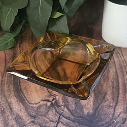 
Vintage Glass Square Amber Ashtray 6"x6" No Chips Or Cracks Elevate your living space with a touch of retro elegance. This vintage amber  Glass ashtr