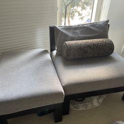Cushioned Grey Chair With Foot Rest And Pillows