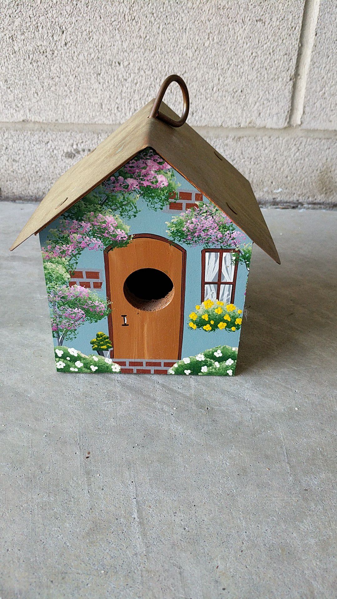 Hand-painted bird house with copper roof