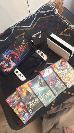Nintendo switch ULED plus games and case