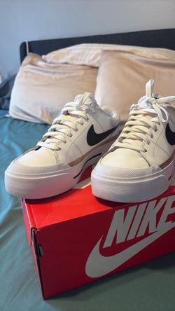 Nike White Low-Top Sneakers with Black Swoosh