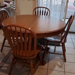 Solid wood pedestal 4-6 seat table formica top, 6 woodchairs