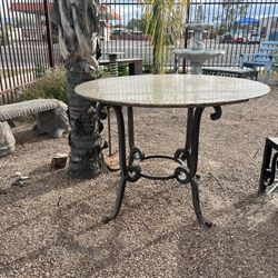 Granite Table With Ornate Iron Base