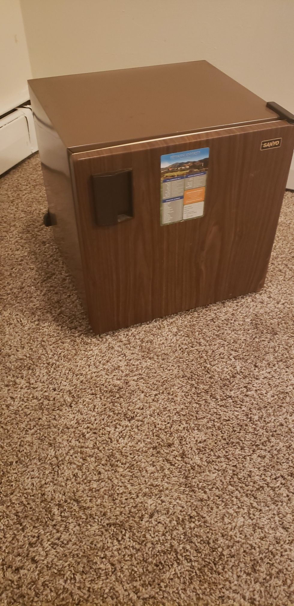 Compact brown mini fridge in great shape