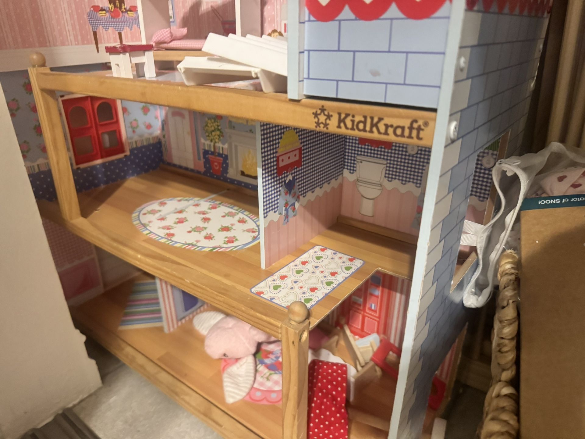 Doll House And Woven Rug