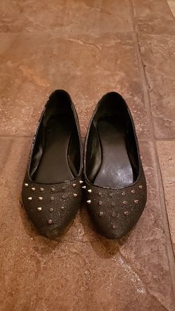 Sparkly black flats with edgy spikes