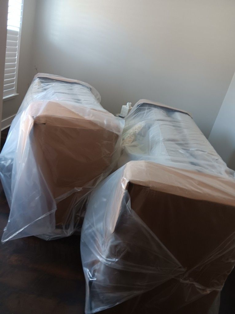 BRAND NEW COUCHES. STILL IN PLASTIC WRAP