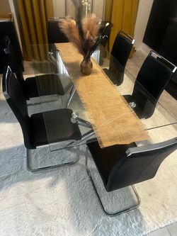 Glass Dining Table with 6 Black Chairs