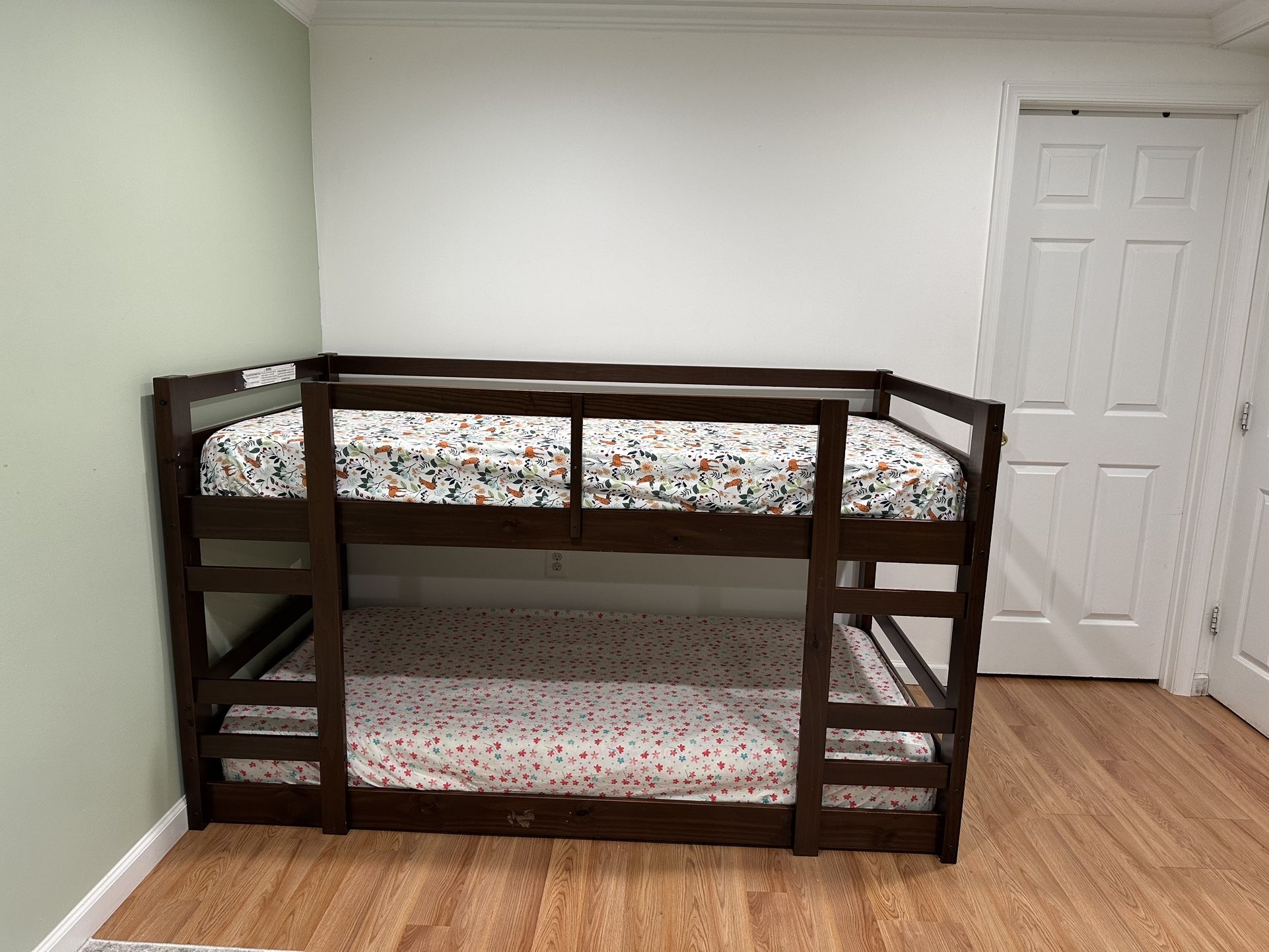Wooden bunk bed with mattresses