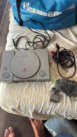 PlayStation One (PS1) w/ one controller, includes power and audio video cables