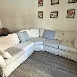 $450– Cream Sectional Couch + White Pillows (Delivery Available)