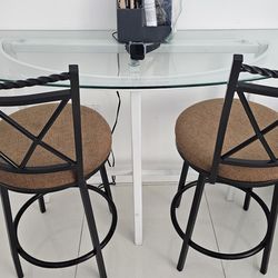 Glass table with bar stools