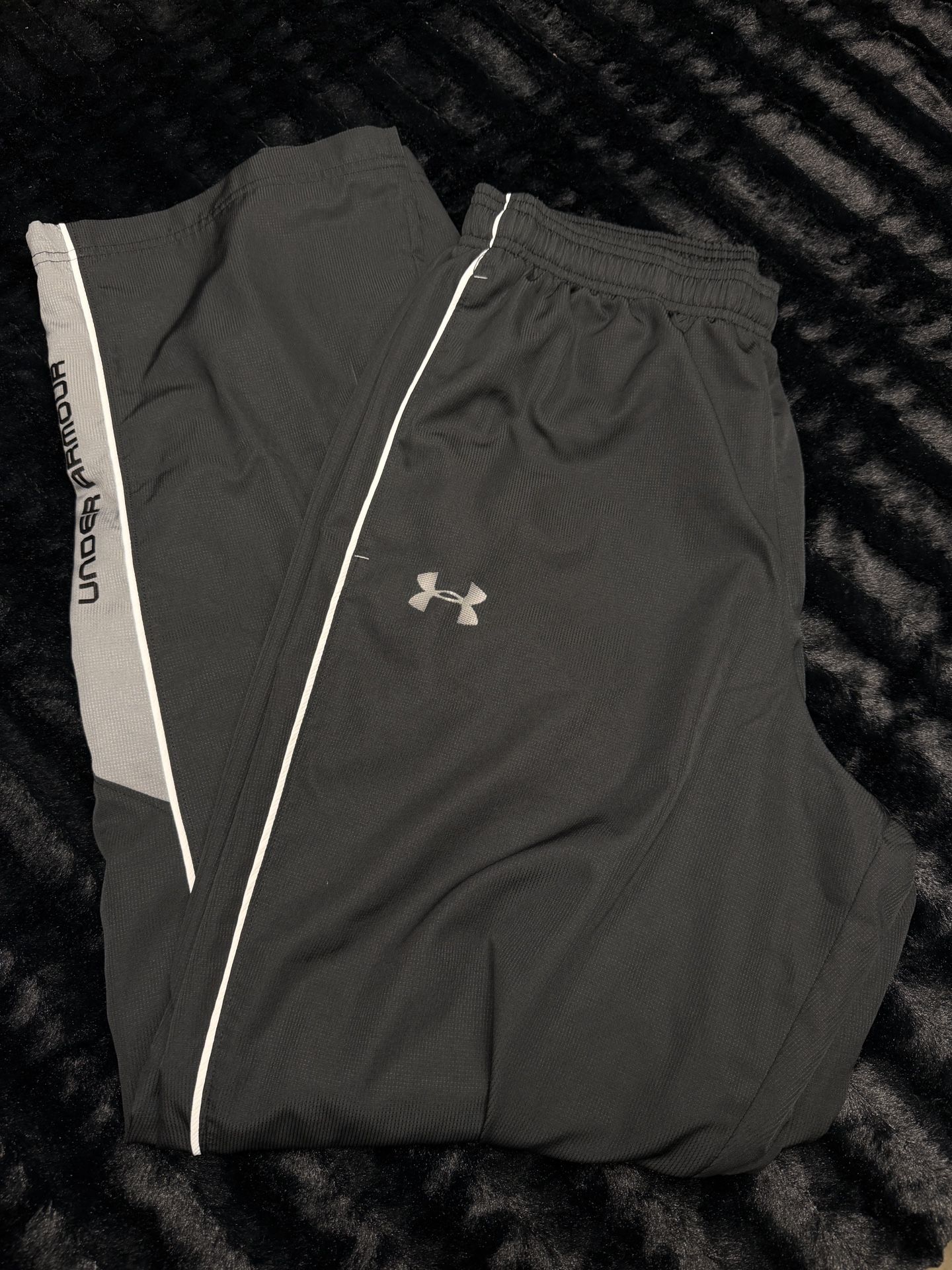 Under Armour men’s Medium black and gray track pants in great shape!  