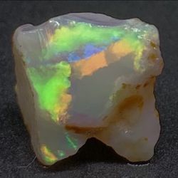Rainbow Australian Coober Pedy Rough Opal Rub With Bright Multfires To The Face