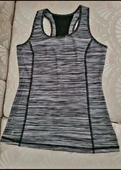 DANSKIN brand workout top Size X-Small but fits more as a Small size.