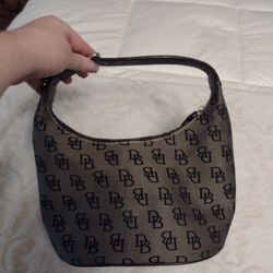 Dooney and Bourke Zip Black Logo Canvas Small Bucket Hobo Handbag . Black and gray in color, in great condition. Measures 10 inches long, 5 inches wid