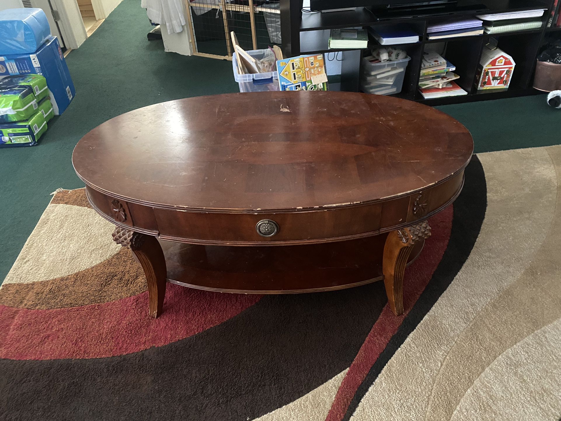 $135-Beautiful  (scratched) coffee table with storage drawer and extra storage shelf underneath  4’ X 2 1/2’ yes it is scratched from use as it is use