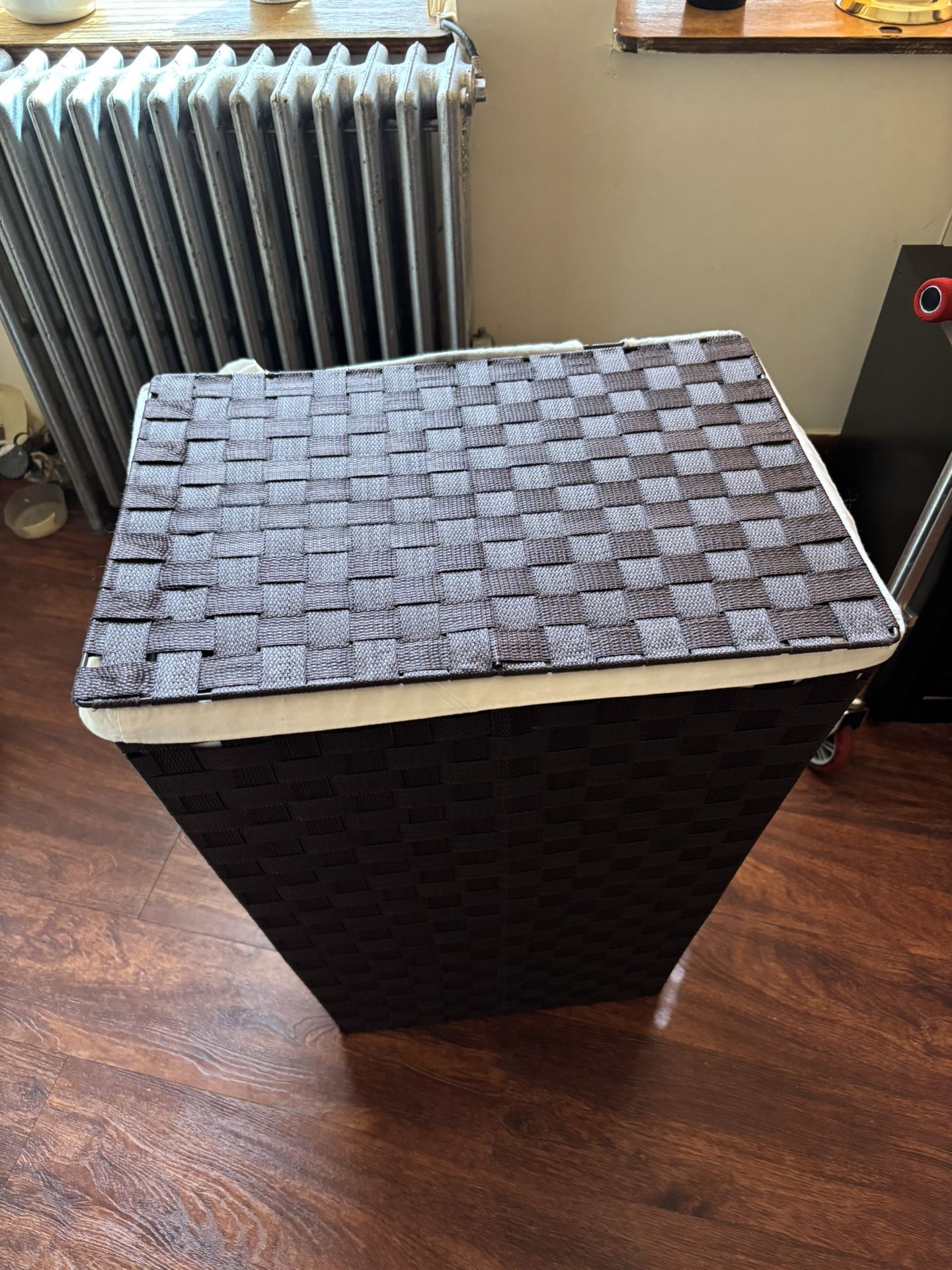 laundry hamper or storage basket with a lid.
