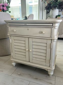 Cream Wood Cabinet with Shutter Doors