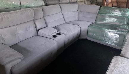 Grey reclining sectional with cup holder