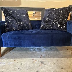 Blue Couch With 2 Pillows 