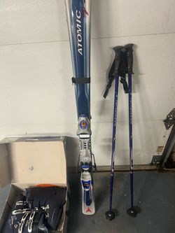 Atomic women’s Skis with Rossignol Poles and Lance Boots