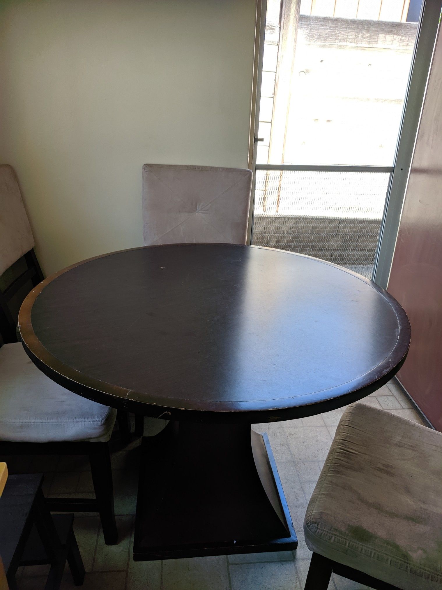 Round wooden kitchen table and chairs