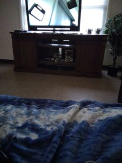 Wooden entertainment center with 6 shelves sliding doors