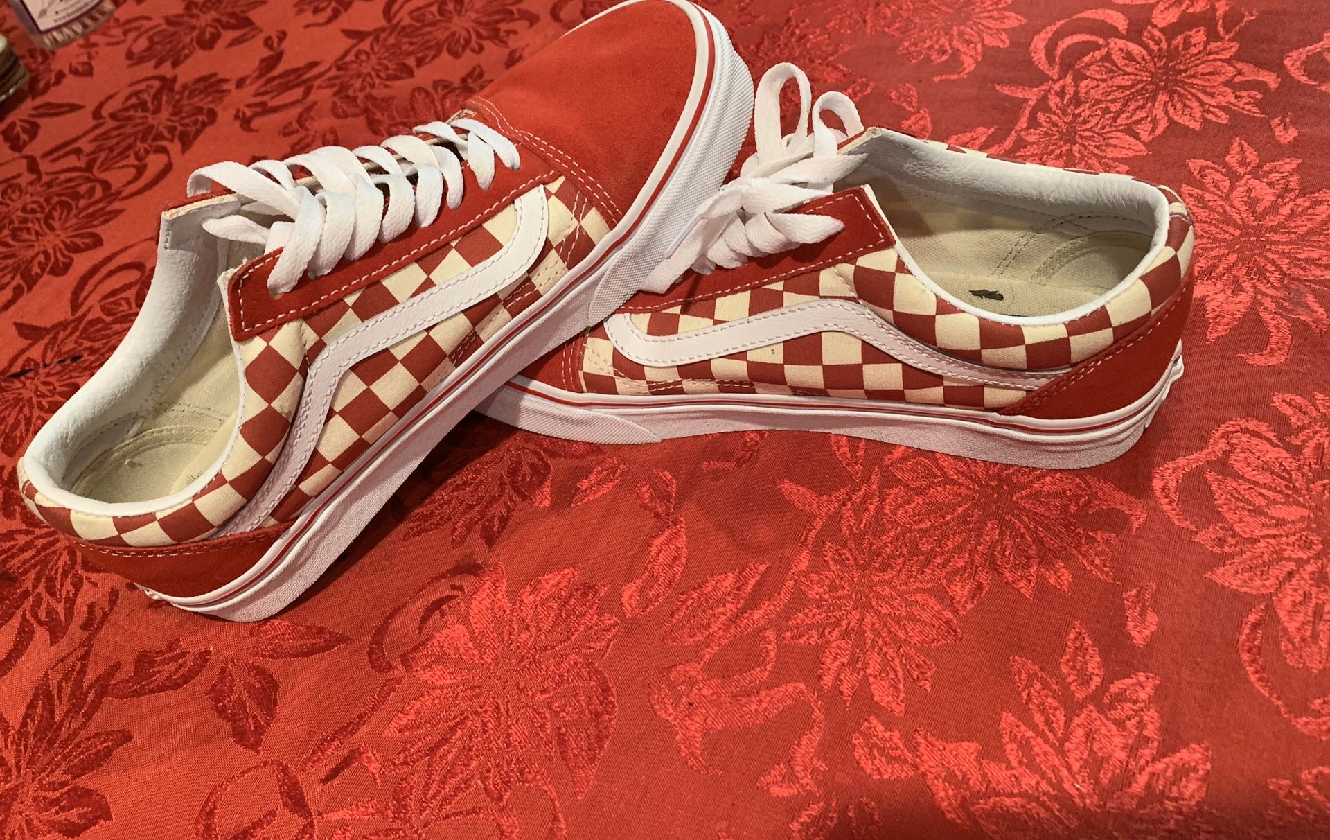 Size 8.5 women’s 7 men’s Red and White checkered Vans