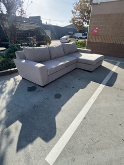 Grey living spaces sectional sofa- delivery available