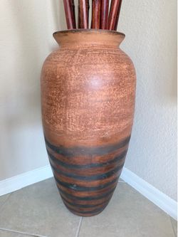 Tall decorative vase with bamboo sticks