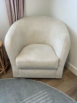 Cream  upholstered swivel chair