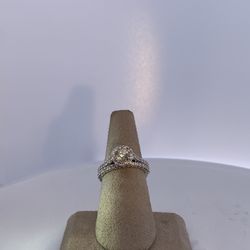 lady’s Two-tone 14 Karat Wedding Set 5.5 with one center 0.50ct round brilliant cut diamond and 0.90Tw side round cut diamonds halo and the band 