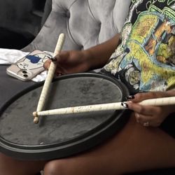 Practice drum pad and sticks