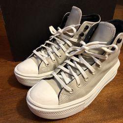 Grey and White High top platform Converse. 