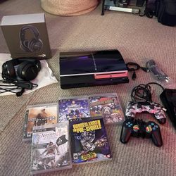 PlayStation 3 with two remotes, 5 games, wireless remote charger and gaming headphones