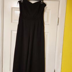 Black Strapless Wide legs jumpsuit. Size M with pockets on sides. Pre-owned 
