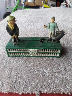 Vintage cast iron bank golf