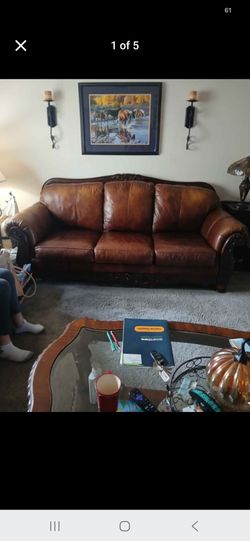 Beautiful natural leather carved wood couch