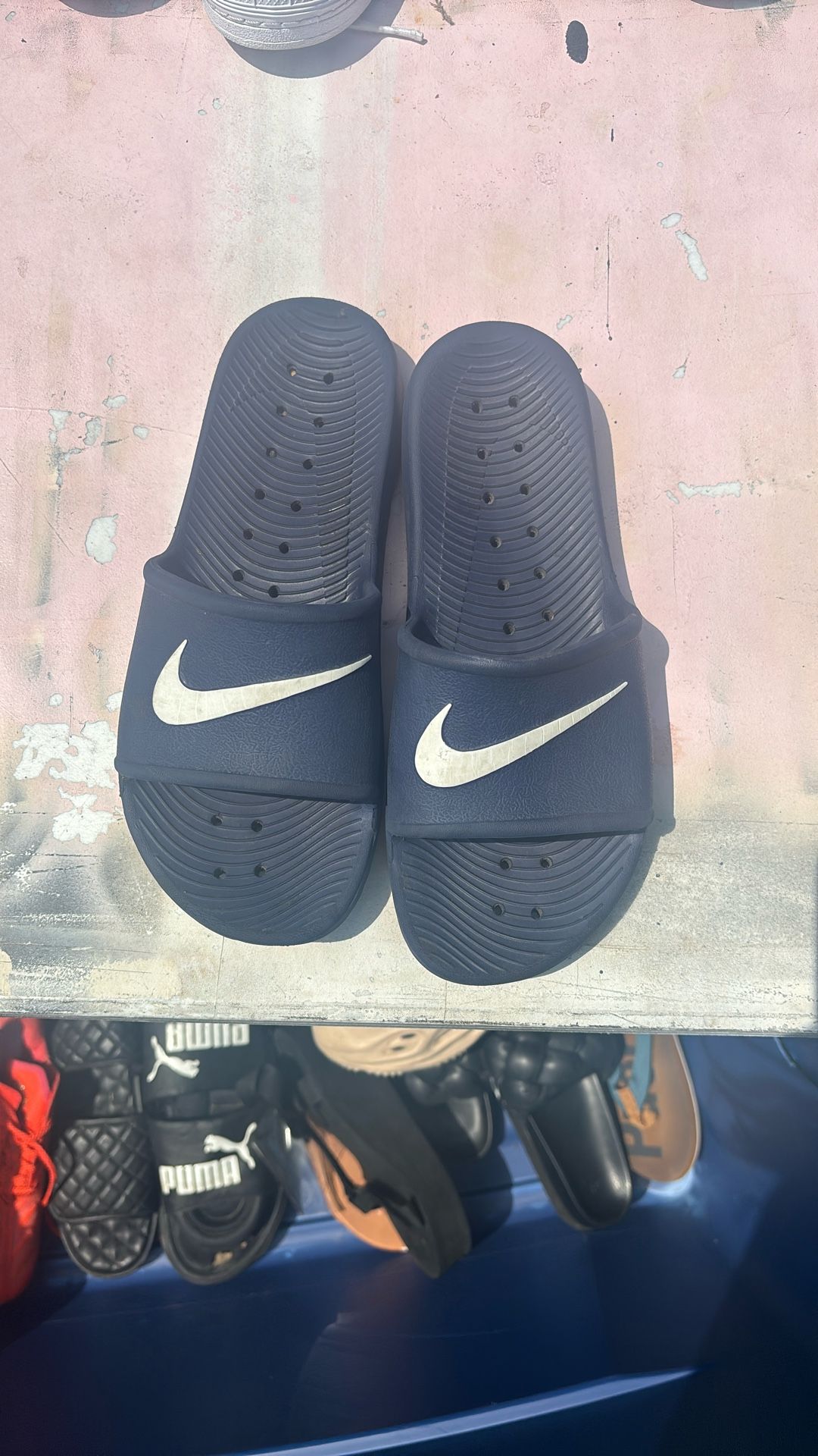 Blue Nike slides nine men