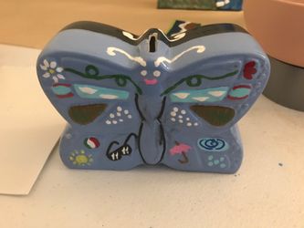 Butterfly saving bank as coins