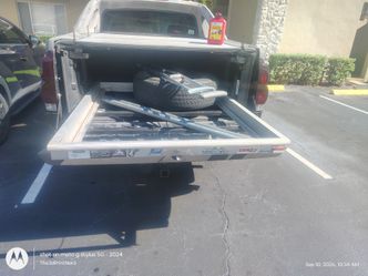 Truck bed slide out frame
