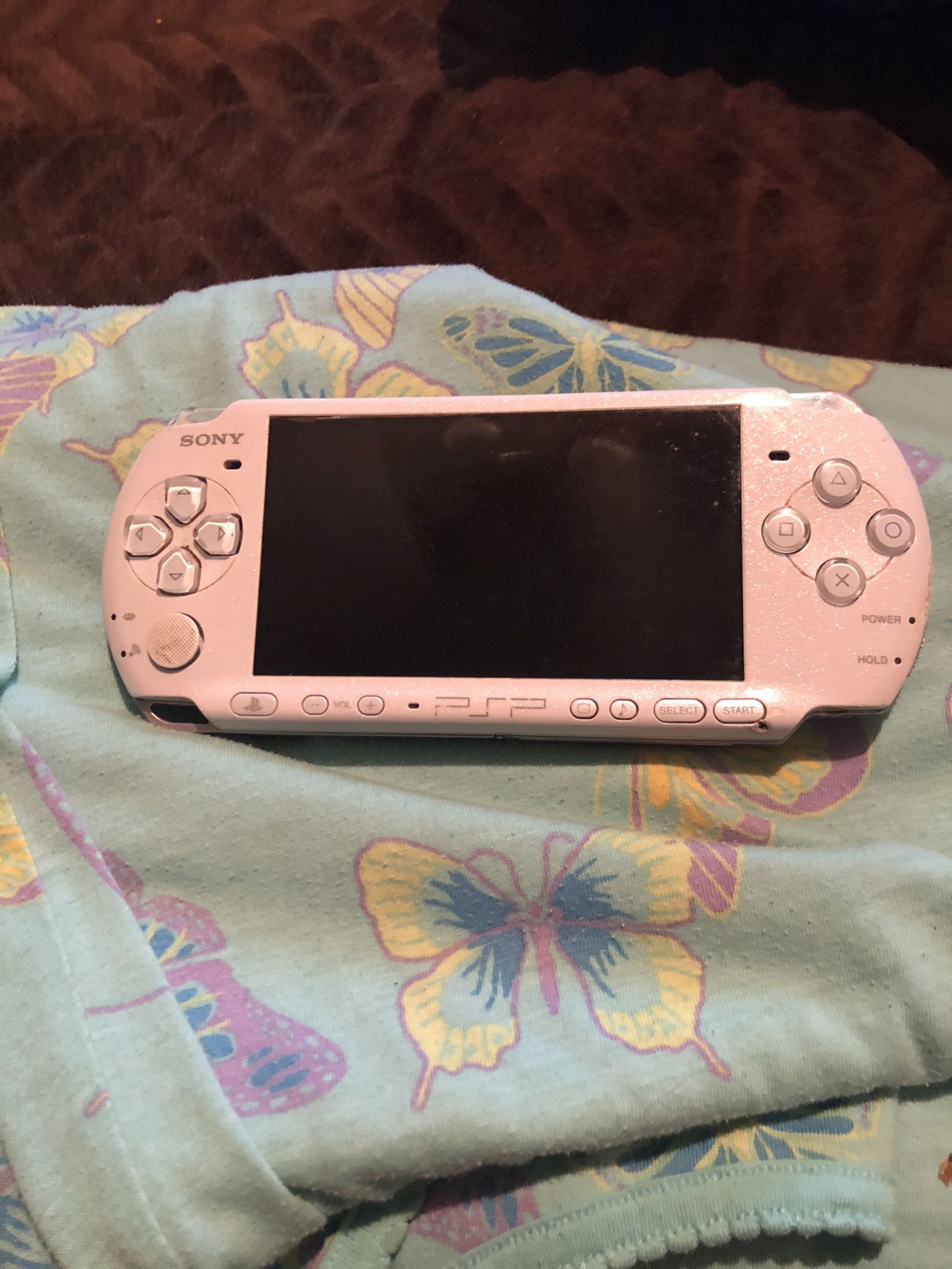 Sony psp with new battery, new charge cord and 9 games .