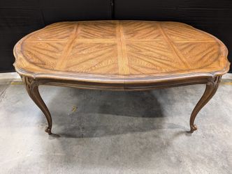 Ornate Oval Wood Dining Table with Inlaid Top